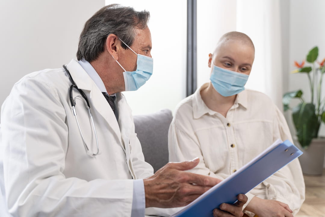young-woman-suffering-of-breast-cancer-talking-with-her-doctor_1.jpg