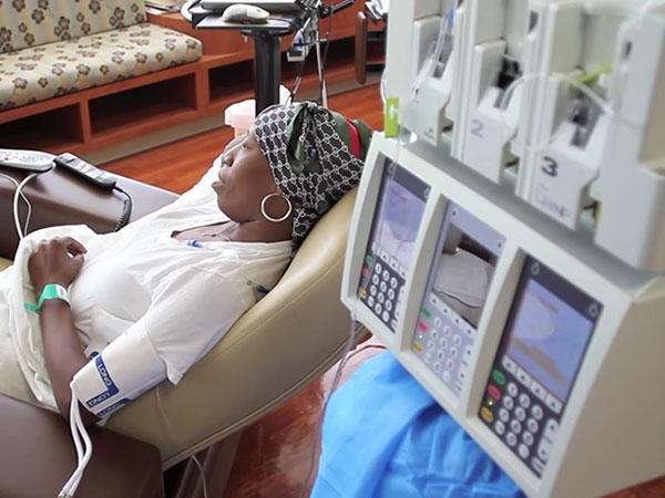 spanish-woman-with-headscarf-getting-chemo-treatment-article.jpg